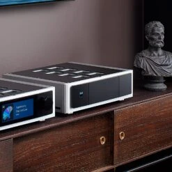 NAD Masters Series M23 HybridDigital Stereo Power Amplifier -Home Electronics Store NADM23M33onWoodCabinetwithDaliTowersCloseSide Facebook 2048x2048 1
